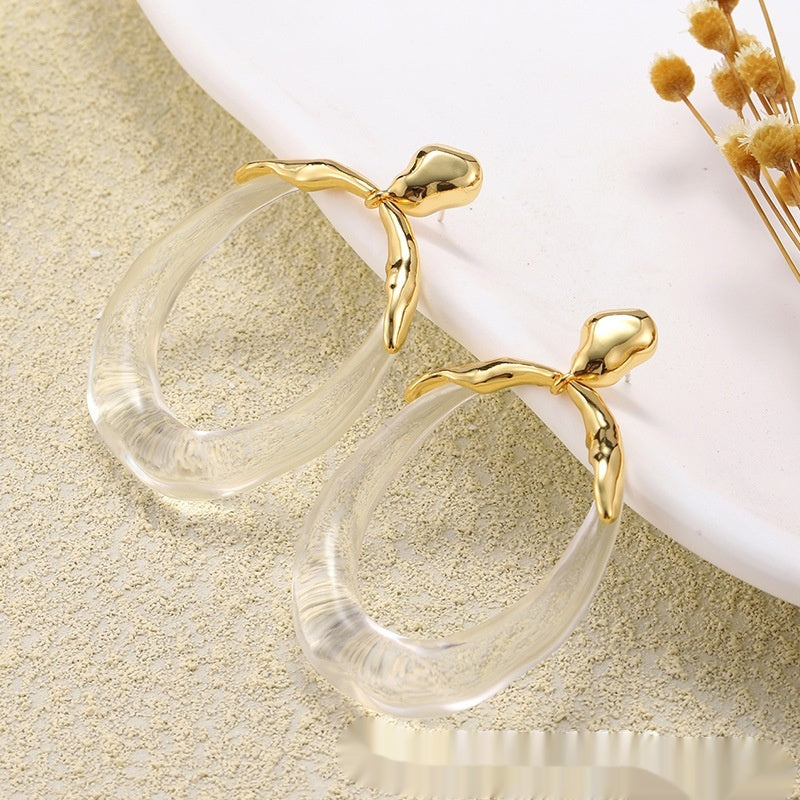 Orecchini a bottone: di design, alla moda, eleganti