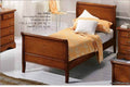 Letto singolo a barchetta intarsiato su noce. Misure cm 94x219x100x72.